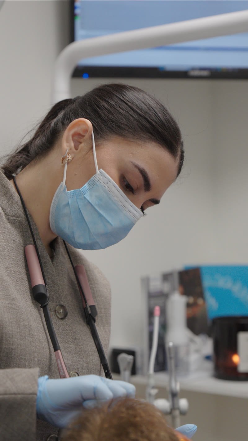 Dr. Cynthia Alfonso planning a smile design with a patient at Lumina Dental Studio